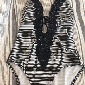 Swimsuit with black and white stripes.